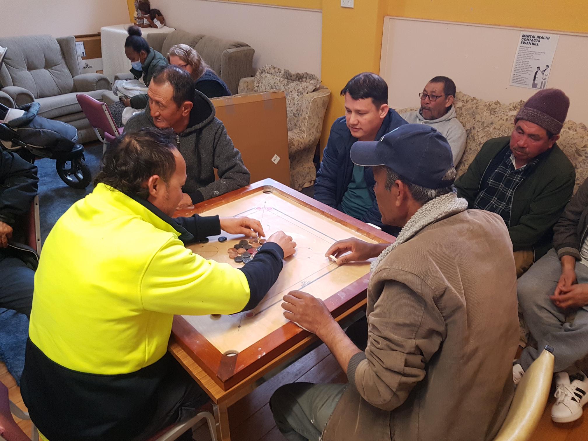 Afghan mens group playing carromba