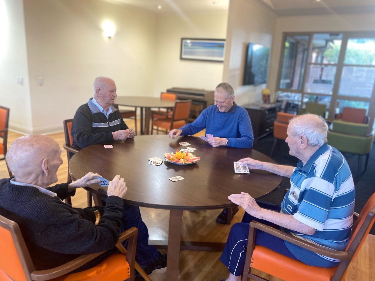 Older people playing cards